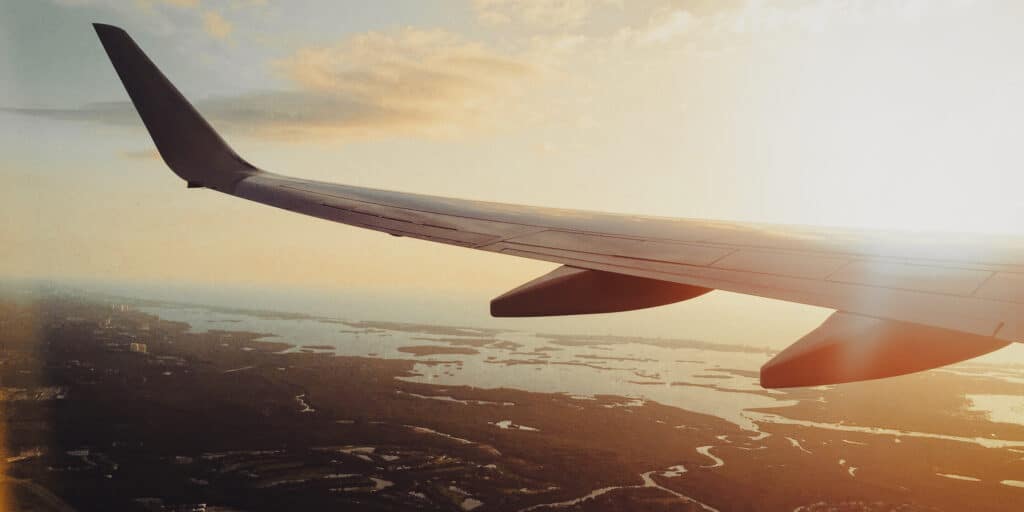 Airplane wing flying in the sky.